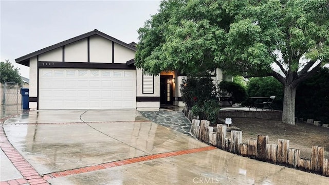 2203 Estrella Ct, Palmdale, CA 93550 - view of front of house featuring an attached garage, concrete driveway, and stucco siding