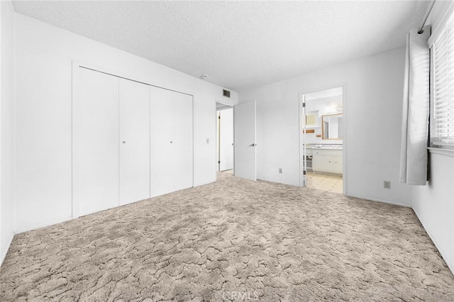 18502 Bellorita St, Rowland Heights, CA 91748 - unfurnished bedroom featuring carpet, a textured ceiling, a closet, and ensuite bath