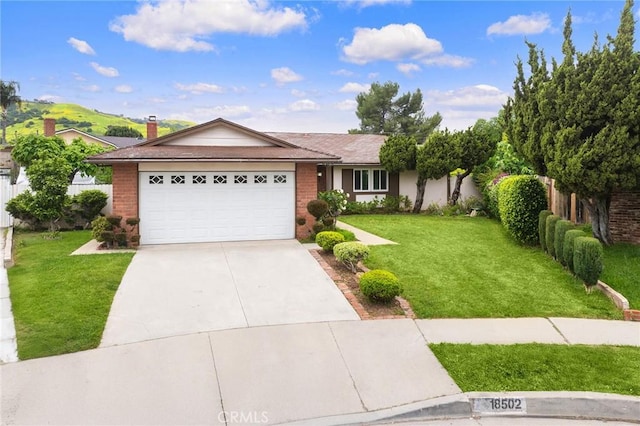 18502 Bellorita St, Rowland Heights, CA 91748 - ranch-style home featuring concrete driveway, a front lawn, an attached garage, and brick siding