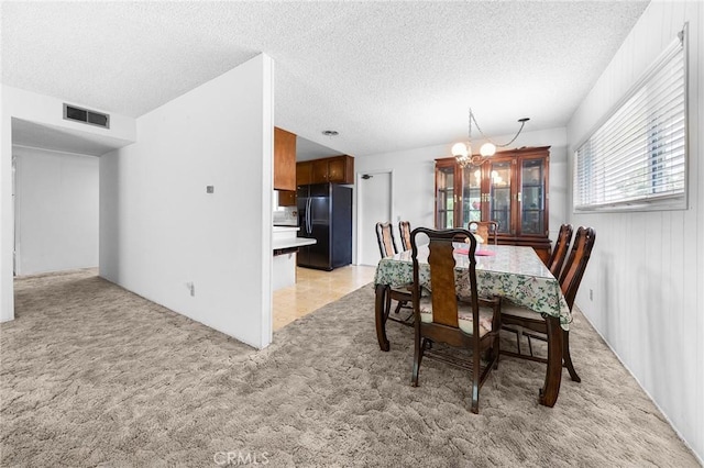 18502 Bellorita St, Rowland Heights, CA 91748 - dining area featuring a chandelier, light carpet, and a textured ceiling
