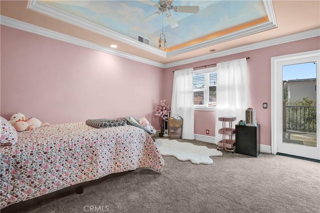 carpeted bedroom with ornamental molding, access to exterior, baseboards, ceiling fan, and a raised ceiling