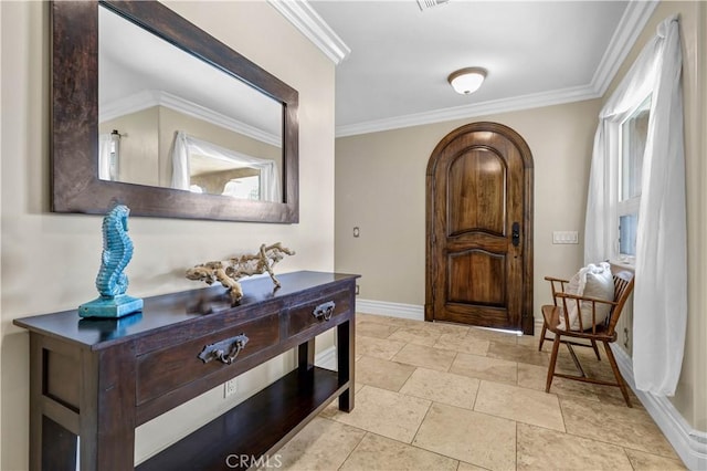 interior space featuring baseboards, stone finish flooring, and ornamental molding