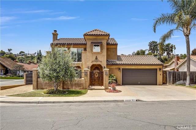 mediterranean / spanish-style house featuring a garage, fence, a chimney, driveway, and a tile roof