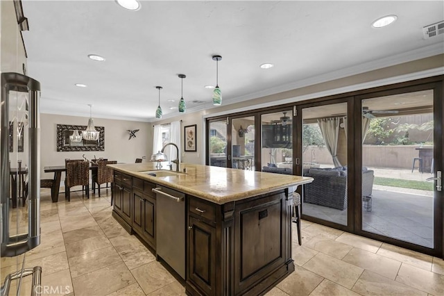 kitchen featuring stainless steel dishwasher, visible vents, dark brown cabinetry, french doors, and a sink