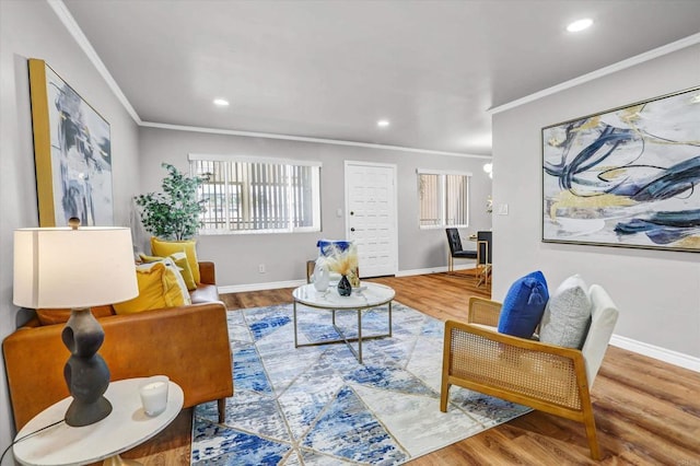 living room with baseboards, ornamental molding, recessed lighting, and wood finished floors