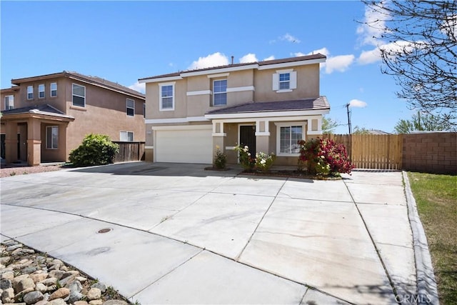 9331 Sapphire Ave, Hesperia, CA 92344 - traditional-style house featuring stucco siding, fence, an attached garage, and driveway