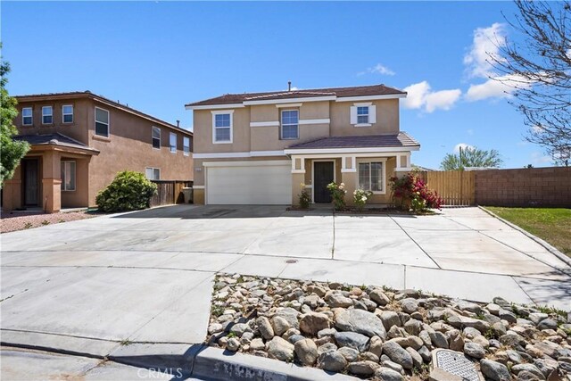 9331 Sapphire Ave, Hesperia, CA 92344 - traditional-style home with stucco siding, a garage, fence, and driveway