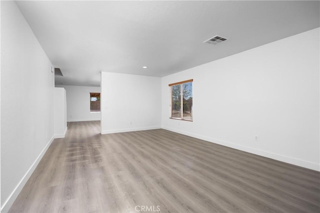 9331 Sapphire Ave, Hesperia, CA 92344 - unfurnished living room featuring wood finished floors and baseboards
