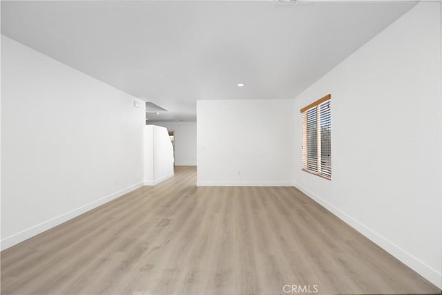 9331 Sapphire Ave, Hesperia, CA 92344 - unfurnished living room featuring light wood-type flooring, baseboards, and recessed lighting