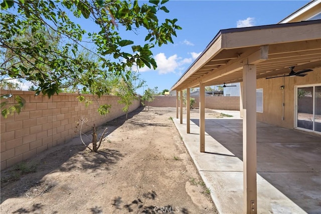 9331 Sapphire Ave, Hesperia, CA 92344 - fenced backyard with a ceiling fan and a patio