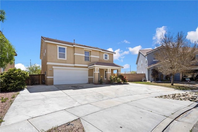 9331 Sapphire Ave, Hesperia, CA 92344 - traditional-style house featuring stucco siding, an attached garage, concrete driveway, and fence