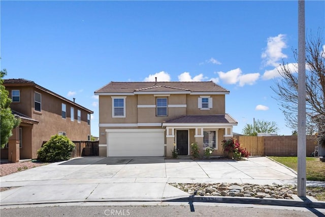 9331 Sapphire Ave, Hesperia, CA 92344 - traditional-style home featuring stucco siding, an attached garage, fence, and concrete driveway