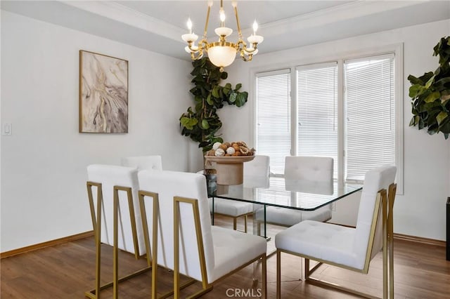 10703 Wheatland Ave, Sunland, CA 91040 - dining area with crown molding, an inviting chandelier, and wood finished floors