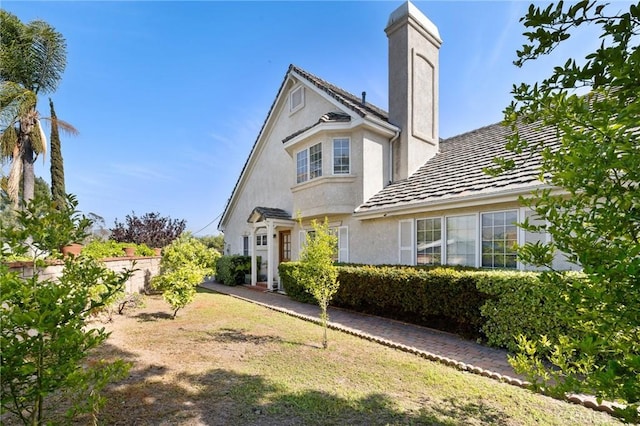 10703 Wheatland Ave, Sunland, CA 91040 - exterior space with fence, stucco siding, and a chimney