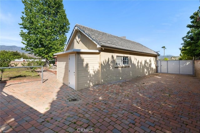 10703 Wheatland Ave, Sunland, CA 91040 - exterior space featuring a patio, a mountain view, stucco siding, and fence