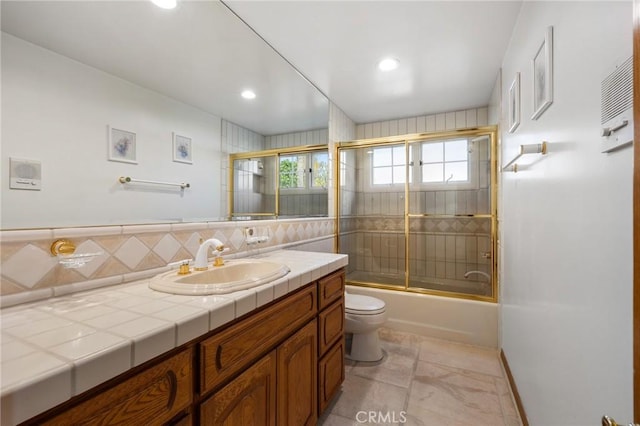 10703 Wheatland Ave, Sunland, CA 91040 - full bathroom with tasteful backsplash, vanity, toilet, shower / bath combination with glass door, and recessed lighting