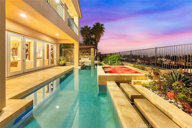 view of pool with a fenced in pool, fence, and a patio