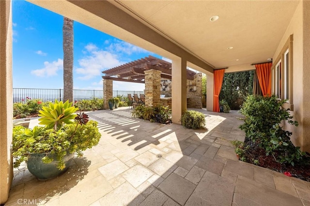 view of patio / terrace with a pergola and fence