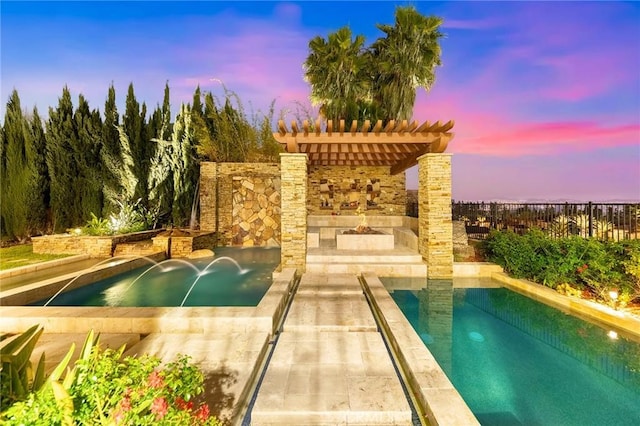 pool with a pergola, fence, and a patio area