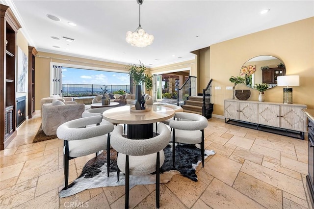 dining space with stone tile floors, baseboards, an inviting chandelier, and a wealth of natural light