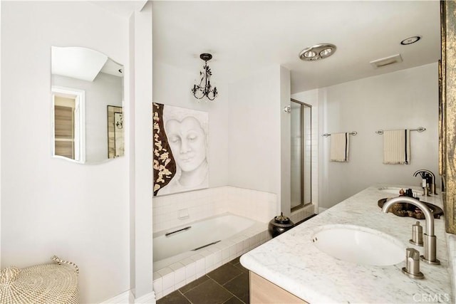 full bath featuring a garden tub, visible vents, double vanity, a shower stall, and a sink