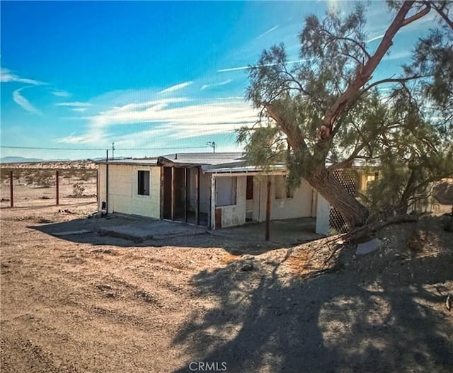 77623 Valle Vista Rd Unit 29, Palms, CA 92277 - rear view of property with a patio area and fence