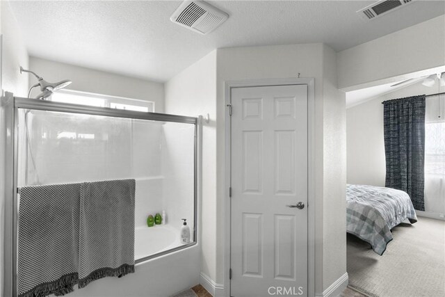 4575 Castillo Dr, Guadalupe, CA 93434 - bathroom with shower / bath combination with glass door, healthy amount of natural light, ensuite bathroom, a textured ceiling, and baseboards