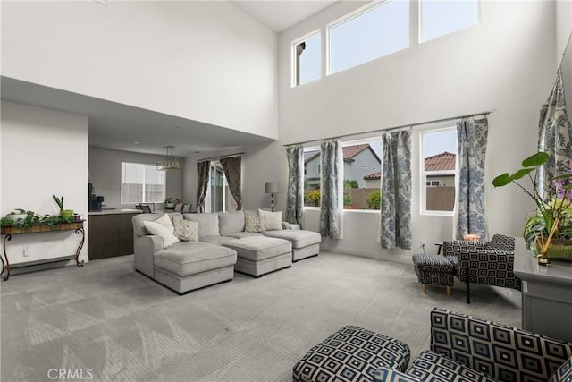 4575 Castillo Dr, Guadalupe, CA 93434 - carpeted living room featuring a towering ceiling and healthy amount of natural light