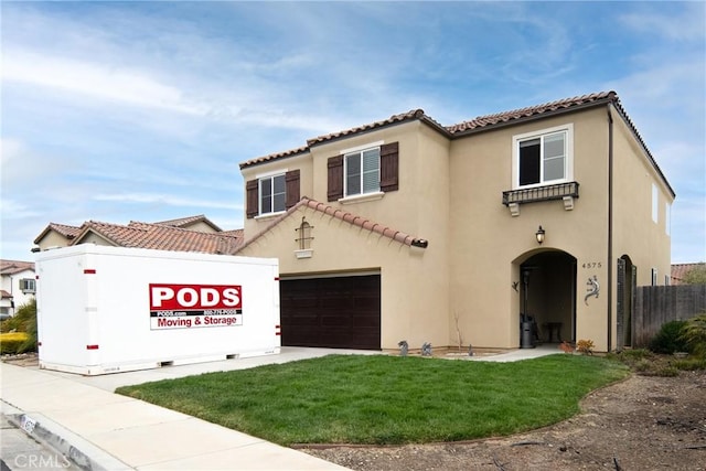 4575 Castillo Dr, Guadalupe, CA 93434 - mediterranean / spanish-style house featuring a tiled roof, stucco siding, and a garage