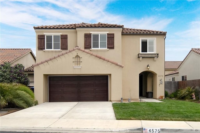 4575 Castillo Dr, Guadalupe, CA 93434 - mediterranean / spanish home with a tile roof, an attached garage, concrete driveway, and stucco siding