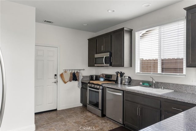 4575 Castillo Dr, Guadalupe, CA 93434 - kitchen featuring appliances with stainless steel finishes, a sink, and baseboards