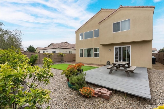 4575 Castillo Dr, Guadalupe, CA 93434 - rear view of property featuring a fenced backyard, stucco siding, and a deck