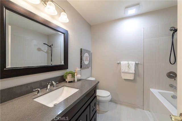 bathroom featuring shower / bath combination, vanity, and toilet