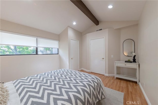 bedroom featuring visible vents, baseboards, recessed lighting, light wood-type flooring, and lofted ceiling with beams