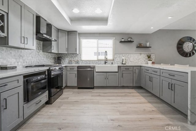 23662 Fair Weather Dr, Canyon Lake, CA 92587 - kitchen with a sink, gray cabinets, stainless steel dishwasher, and wall chimney range hood