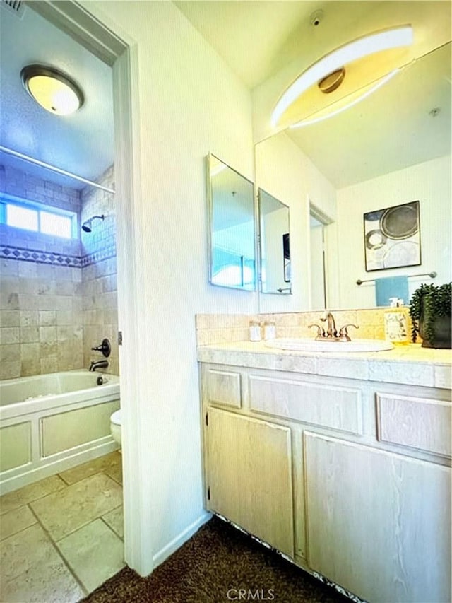 bathroom featuring vanity, toilet, and bathing tub / shower combination