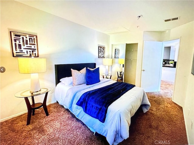 carpeted bedroom featuring visible vents