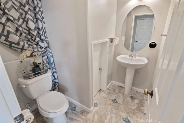 6239 Longmeadow St, Riverside, CA 92505 - bathroom with toilet, baseboards, and a sink