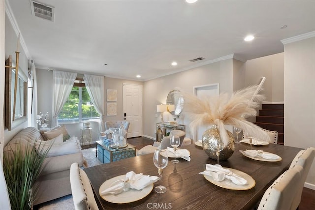 dining room with crown molding, recessed lighting, and visible vents