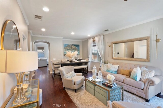 6239 Longmeadow St, Riverside, CA 92505 - living area featuring arched walkways, crown molding, wood finished floors, and recessed lighting