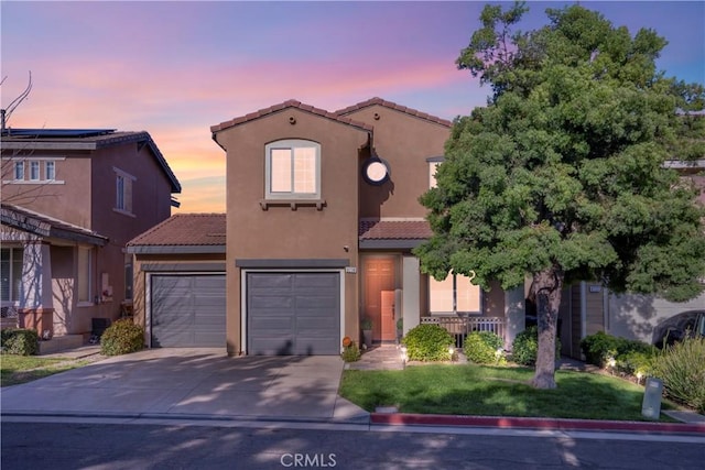6239 Longmeadow St, Riverside, CA 92505 - mediterranean / spanish-style house featuring a tile roof, concrete driveway, stucco siding, and a front lawn