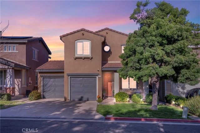6239 Longmeadow St, Riverside, CA 92505 - mediterranean / spanish-style house featuring a tile roof, concrete driveway, stucco siding, and an attached garage