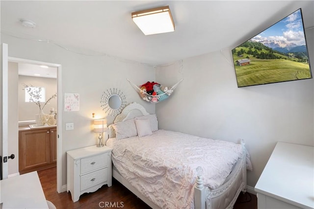 bedroom featuring dark wood-style floors