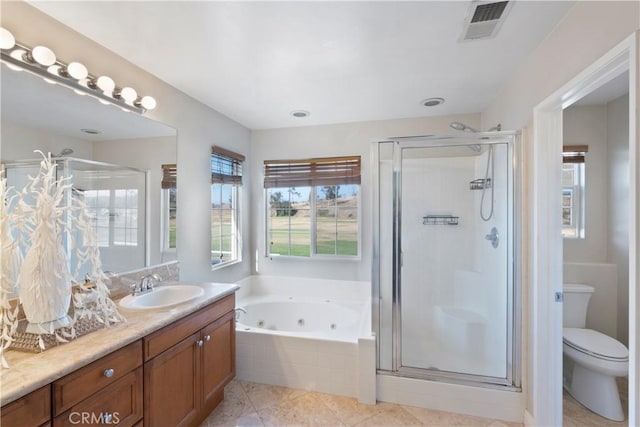 full bathroom featuring visible vents, a jetted tub, and a shower stall