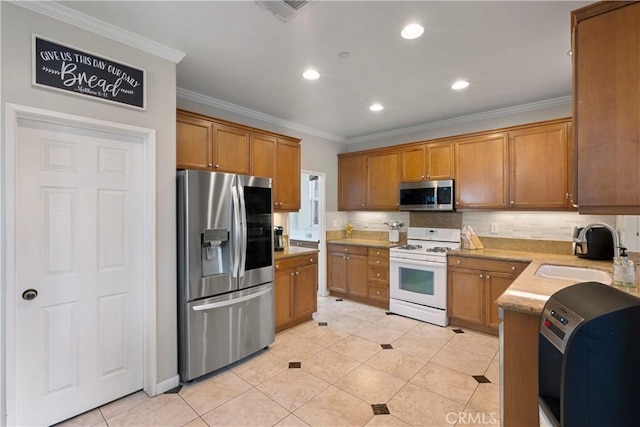6239 Longmeadow St, Riverside, CA 92505 - kitchen with stainless steel appliances, crown molding, brown cabinets, light tile patterned flooring, and recessed lighting
