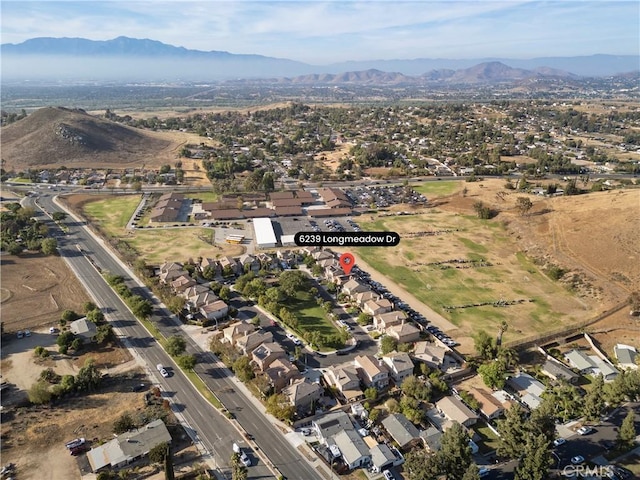 birds eye view of property featuring a mountain view and a residential view