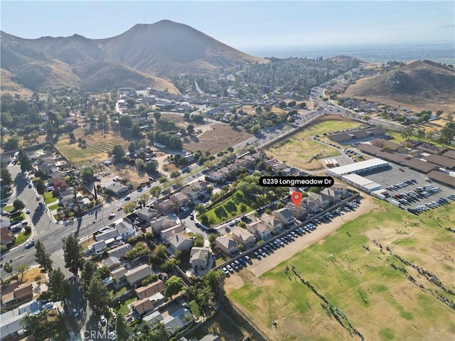 birds eye view of property with a mountain view