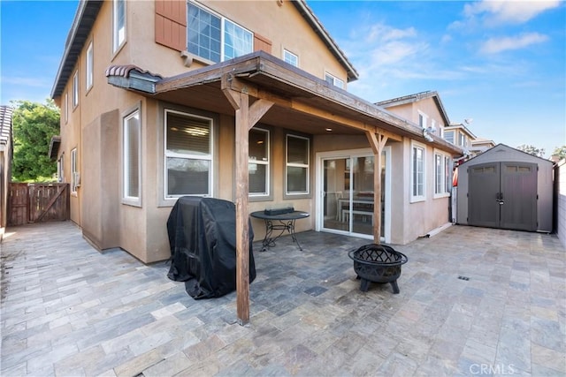 6239 Longmeadow St, Riverside, CA 92505 - back of house with a patio, a fire pit, and stucco siding