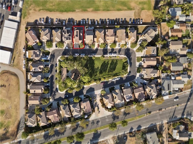 birds eye view of property with a residential view
