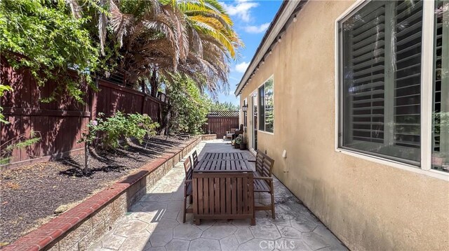24939 Coral Canyon Rd, Corona, CA 92883 - fenced backyard featuring a patio area